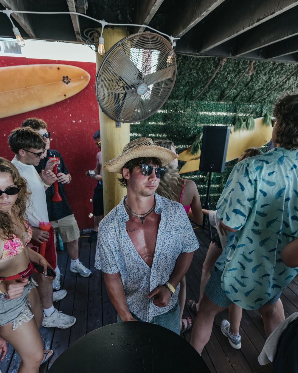 A friend in a straw hat and sunglasses at a Señor Frog's day party in Panama City Beach